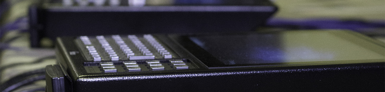 A close-up of the screen and keyboard of two Tempus Pros lying on their backs